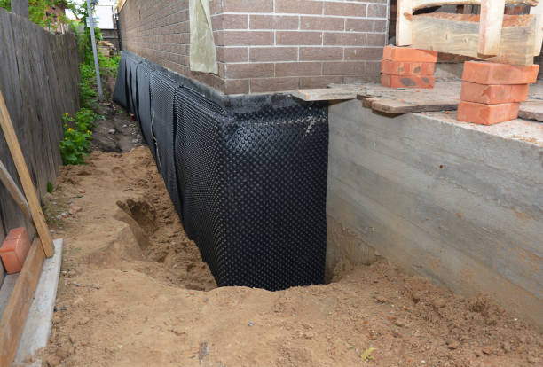 Happy homeowners after waterproofing job in Erin